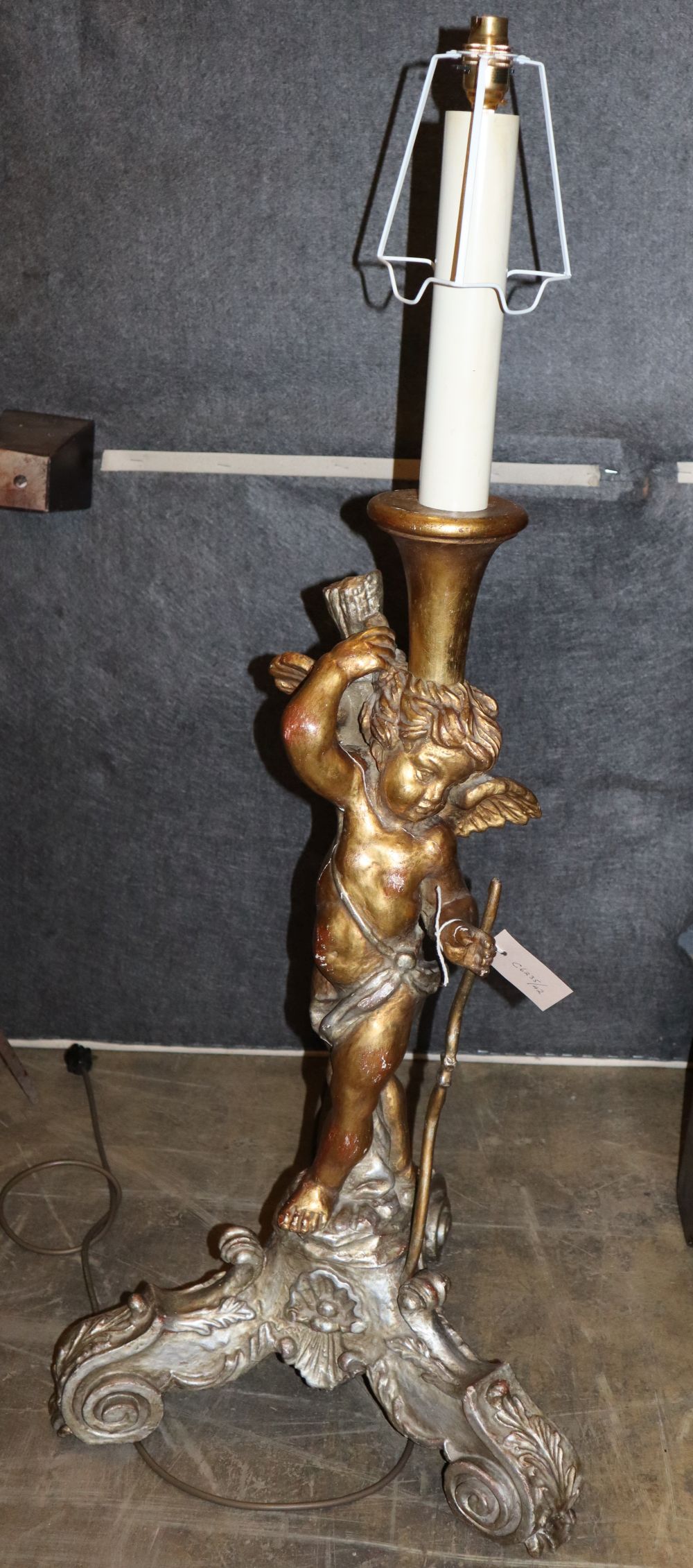 An Italian style giltwood and gesso cupid floor lamp, H.75cm